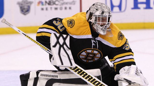 BOSTON - APRIL 25: Boston Bruins goalie Tim Thomas (#30) covers up the puck during the third period. Boston Bruins took on the Washington Capitals in game seven of the Stanley Cup Eastern Conference quarterfinals at TD Garden.
