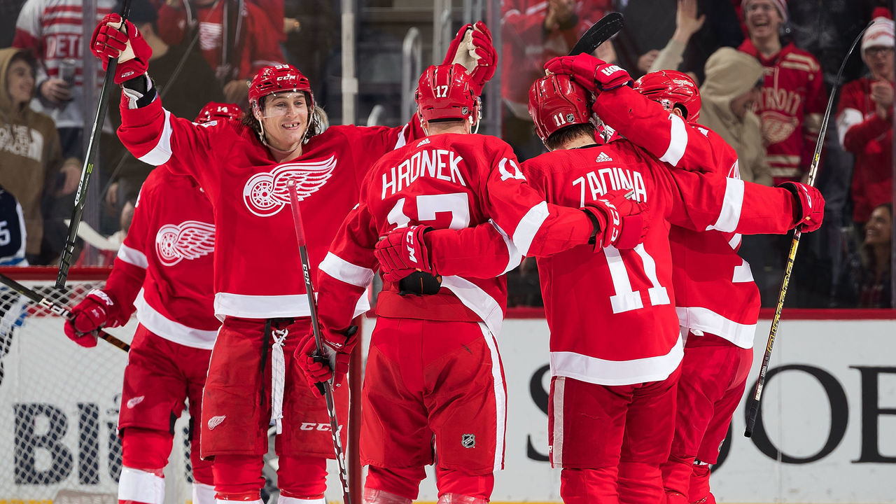 DETROIT, MI - DECEMBER 12: Filip Zadina #11 of the Detroit Red Wings celebrates his second period goal with teammates Tyler Bertuzzi #59 and Filip Hronek #17 during an NHL game against the Winnipeg Jets at Little Caesars Arena on December 12, 2019 in Detroit, Michigan.