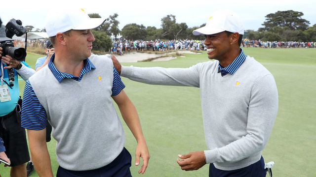 MELBOURNE, AUSTRALIA - DECEMBER 13: Playing Captain Tiger Woods of the United States team and Justin Thomas of the United States team celebrate defeating Byeong-Hun An of South Korea and the International team and Hideki Matsuyama of Japan and the International team 1up on the 18th green during Friday foursome matches on day two of the 2019 Presidents Cup at Royal Melbourne Golf Course on December 13, 2019 in Melbourne, Australia.