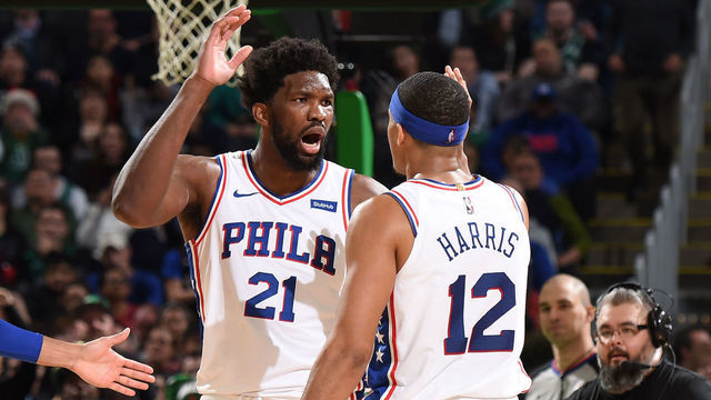 BOSTON, MA - DECEMBER 12: Joel Embiid #21 of the Philadelphia 76ers high-fives Tobias Harris #12 of the Philadelphia 76ers against the Boston Celtics on December 12, 2019 at the TD Garden in Boston, Massachusetts. Mandatory Copyright Notice: Copyright 2019 NBAE