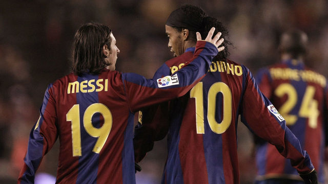 VALLADOLID, SPAIN - NOVEMBER 01: Lionel Messi of Barcelona congratulates Ronaldinho after he scored Barcelona's first goal during the La Liga match between Valladolid and Barcelona at the Jose Sorillo stadium on November 1, 2007 in Valladolid, Spain.