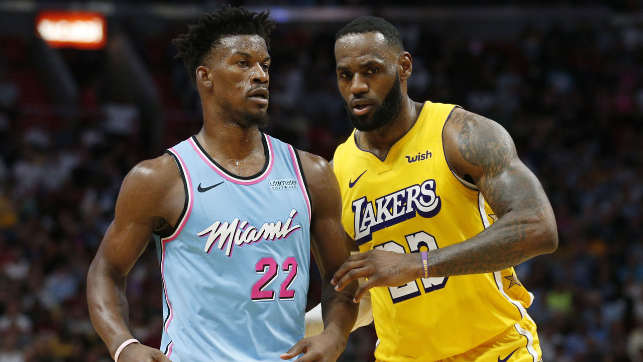 MIAMI, FLORIDA - DECEMBER 13: LeBron James #23 of the Los Angeles Lakers guards Jimmy Butler #22 of the Miami Heat during the second half at American Airlines Arena on December 13, 2019 in Miami, Florida. NOTE TO USER: User expressly acknowledges and agrees that, by downloading and/or using this photograph, user is consenting to the terms and conditions of the Getty Images License Agreement