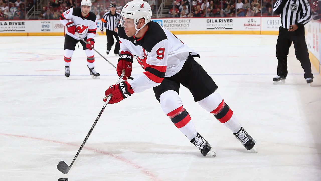 GLENDALE, AZ - DECEMBER 02: Taylor Hall #9 of the New Jersey Devils skates with the puck during the second period of the NHL game against the Arizona Coyotes at Gila River Arena on December 2, 2017 in Glendale, Arizona. The Coyotes defeated the Devils 5-0.