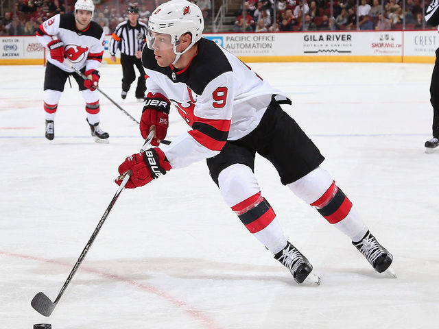 GLENDALE, AZ - DECEMBER 02: Taylor Hall #9 of the New Jersey Devils skates with the puck during the second period of the NHL game against the Arizona Coyotes at Gila River Arena on December 2, 2017 in Glendale, Arizona. The Coyotes defeated the Devils 5-0.
