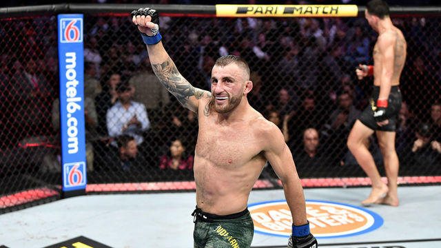 LAS VEGAS, NEVADA - DECEMBER 14: Alexander Volkanovski of Australia celebrates in the octagon at the end of the match during the UFC 245 event at T-Mobile Arena on December 14, 2019 in Las Vegas, Nevada.