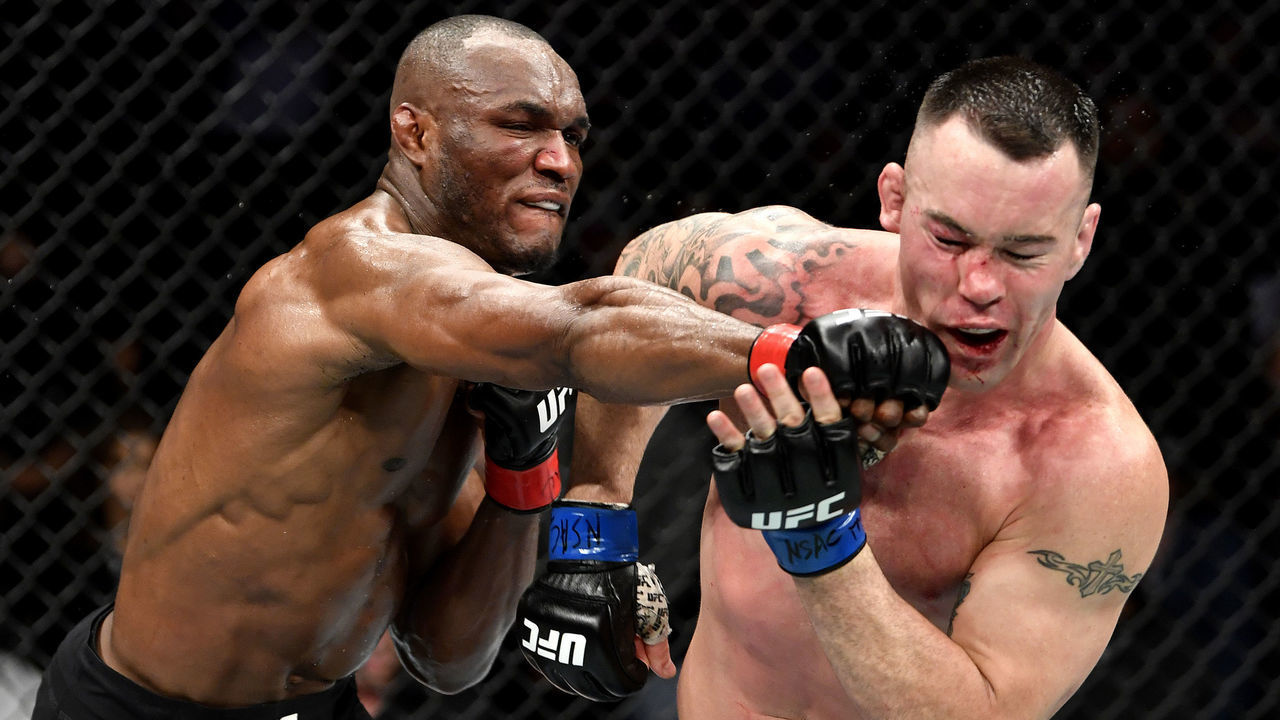 LAS VEGAS, NEVADA - DECEMBER 14: (L-R) Kamaru Usman of Nigeria strikes Colby Covington in their UFC welterweight championship bout during the UFC 245 event at T-Mobile Arena on December 14, 2019 in Las Vegas, Nevada.