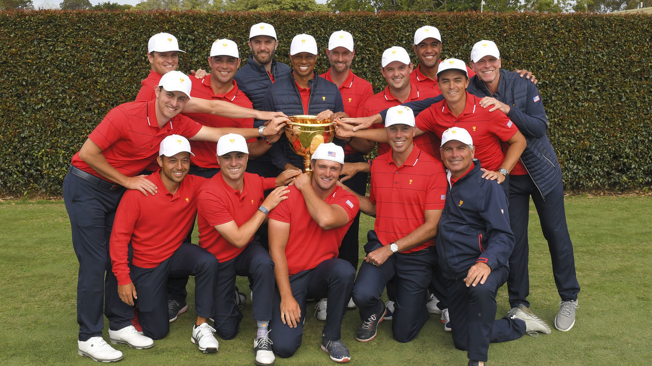 VICTORIA , AUSTRALIA - DECEMBER 15: U.S. Team pose with the Presidents Cup trophy after the final round singles matches at the Presidents Cup at The Royal Melbourne Golf Club on December 15, 2019, in Victoria , Australia.