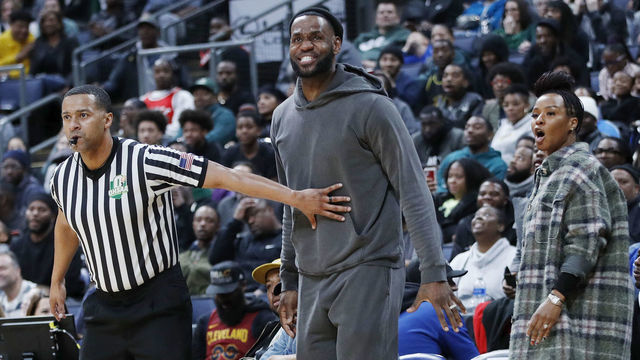 COLUMBUS, OH - DECEMBER 14: LeBron James of the Los Angeles Lakers is restrained by a referee while watching son Bronny play with Sierra Canyon High School during the Ohio Scholastic Play-By-Play Classic against St. Vincent-St. Mary High School at Nationwide Arena on December 14, 2019 in Columbus, Ohio.