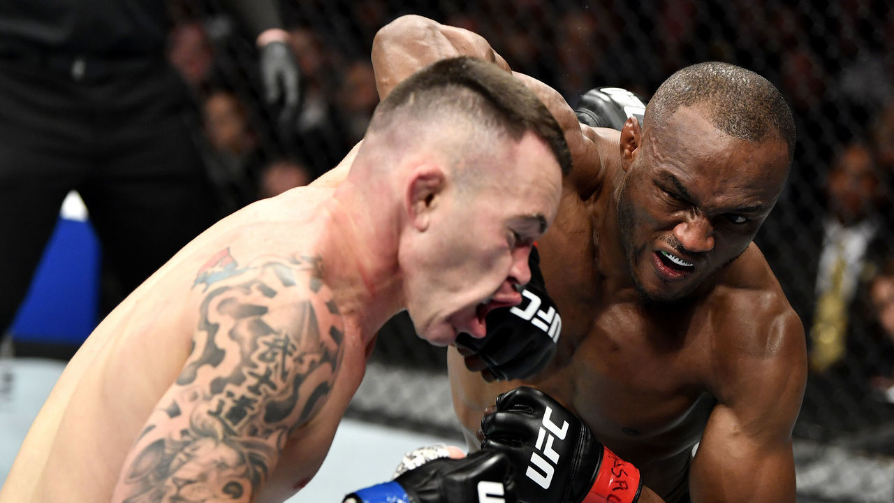 LAS VEGAS, NEVADA - DECEMBER 14: (R-L) Kamaru Usman of Nigeria strikes Colby Covington in their UFC welterweight championship bout during the UFC 245 event at T-Mobile Arena on December 14, 2019 in Las Vegas, Nevada.