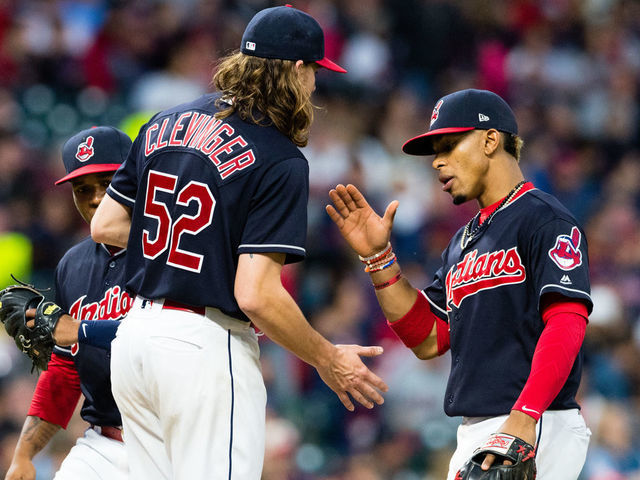CLEVELAND, OH - MAY 26: Starting pitcher Mike Clevinger #52 celebrates with shortstop Francisco Lindor #12 of the Cleveland Indians as Clevenger leaves the game during the sixth inning against the Kansas City Royals at Progressive Field on May 26, 2017 in Cleveland, Ohio.
