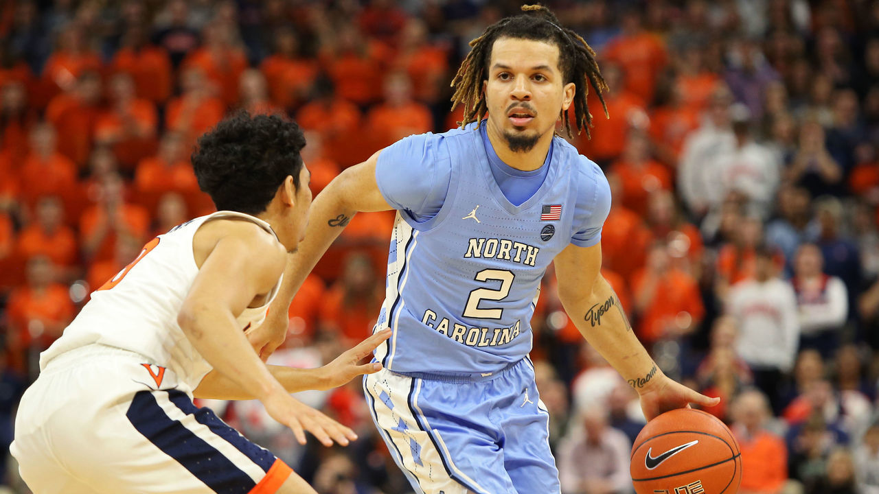 CHARLOTTESVILLE, VA - DECEMBER 07: Cole Anthony #2 of the North Carolina Tar Heels drives toward Kihei Clark #0 of the Virginia Cavaliers in the first half during a game at John Paul Jones Arena on December 7, 2019 in Charlottesville, Virginia.