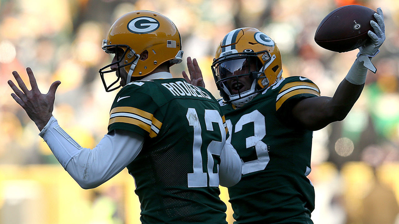 GREEN BAY, WISCONSIN - DECEMBER 15: Running back Aaron Jones #33 of the Green Bay Packers and quarterback Aaron Rodgers #12 of the Green Bay Packers celebrate a touchdown in the third quarter of the game against the Chicago Bears at Lambeau Field on December 15, 2019 in Green Bay, Wisconsin.