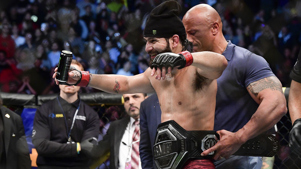 NEW YORK, NEW YORK - NOVEMBER 02: Jorge Masvidal of the United States is awarded the belt by Dwayne "the Rock" Johnson after his victory by TKO on a medical stoppage against Nate Diaz of the United States in the Welterweight "BMF" championship bout during UFC 244 at Madison Square Garden on November 02, 2019 in New York City.