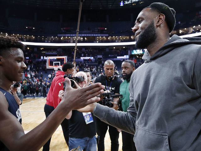 COLUMBUS, OH - DECEMBER 14: LeBron 'Bronny' James Jr. #0 of Sierra Canyon High School is greeted by his father LeBron James of the Los Angeles Lakers following the Ohio Scholastic Play-By-Play Classic against St. Vincent-St. Mary High School at Nationwide Arena on December 14, 2019 in Columbus, Ohio.