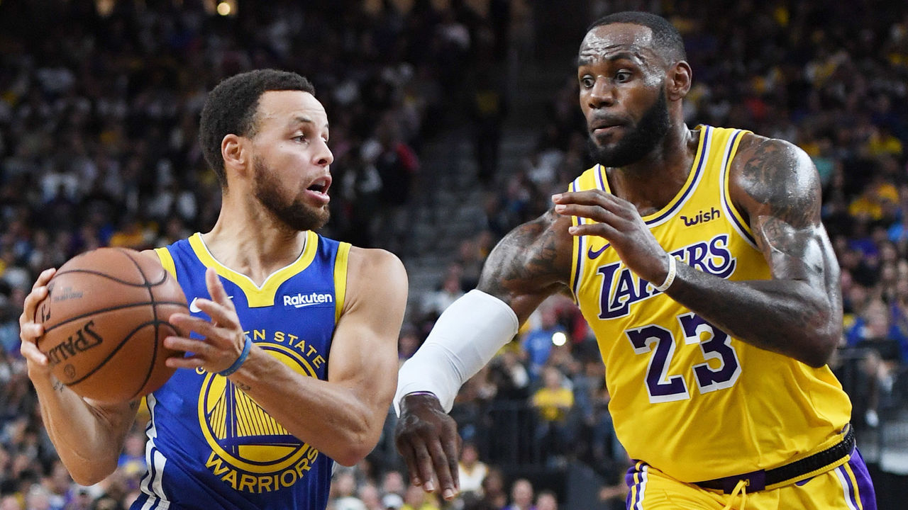 LAS VEGAS, NEVADA - OCTOBER 10: Stephen Curry #30 of the Golden State Warriors drives against LeBron James #23 of the Los Angeles Lakers during their preseason game at T-Mobile Arena on October 10, 2018 in Las Vegas, Nevada. The Lakers defeated the Warriors 123-113.