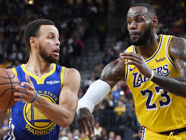 LAS VEGAS, NEVADA - OCTOBER 10: Stephen Curry #30 of the Golden State Warriors drives against LeBron James #23 of the Los Angeles Lakers during their preseason game at T-Mobile Arena on October 10, 2018 in Las Vegas, Nevada. The Lakers defeated the Warriors 123-113.