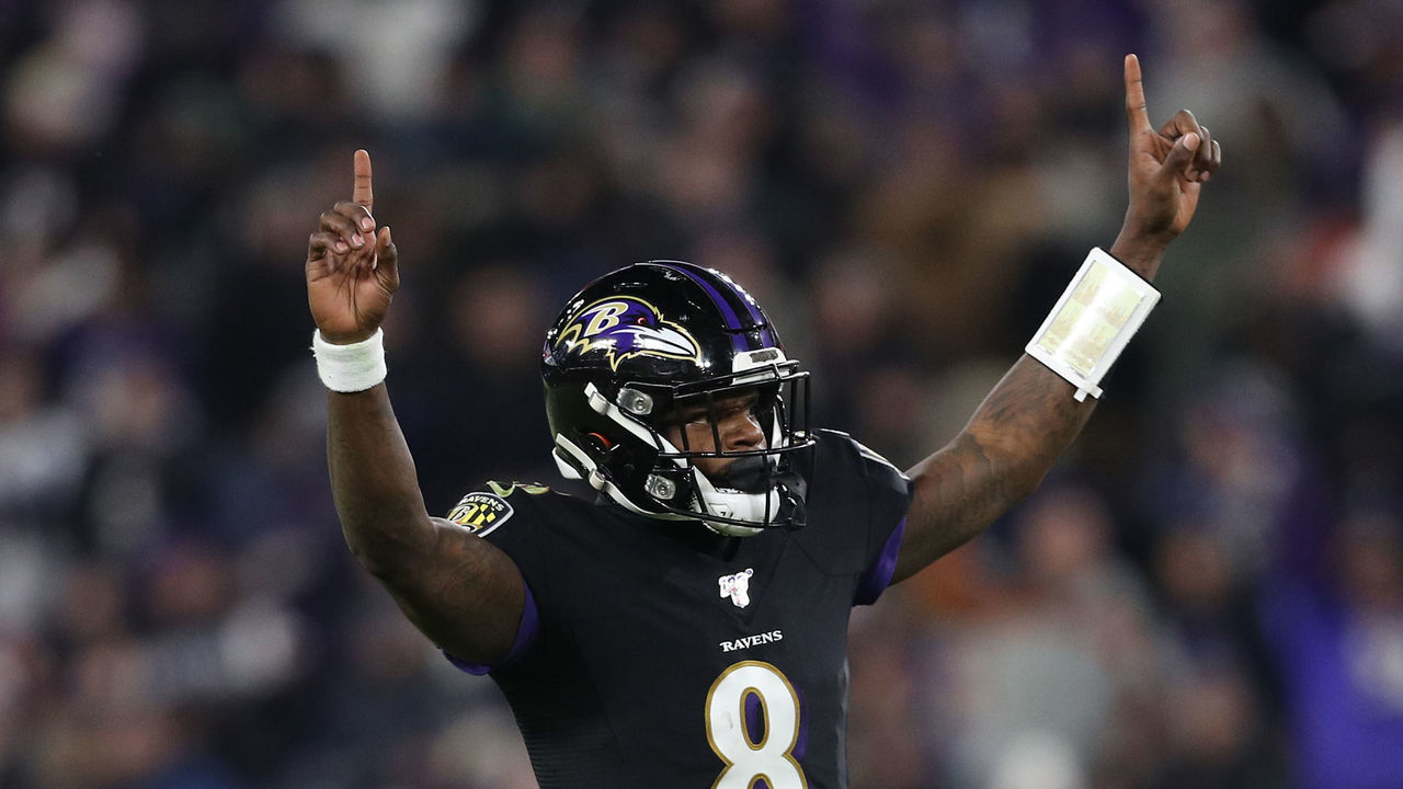 BALTIMORE, MARYLAND - DECEMBER 12: Quarterback Lamar Jackson #8 of the Baltimore Ravens celebrates after throwing a touchdown pass to wide receiver Marquise Brown #15 (not pictured) against the New York Jets during the third quarter at M&T Bank Stadium on December 12, 2019 in Baltimore, Maryland.
