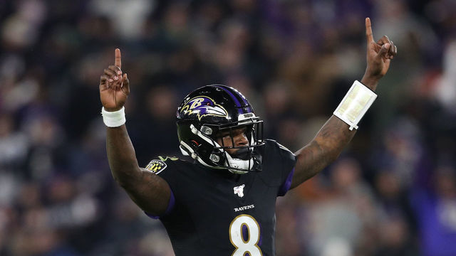 BALTIMORE, MARYLAND - DECEMBER 12: Quarterback Lamar Jackson #8 of the Baltimore Ravens celebrates after throwing a touchdown pass to wide receiver Marquise Brown #15 (not pictured) against the New York Jets during the third quarter at M&T Bank Stadium on December 12, 2019 in Baltimore, Maryland.