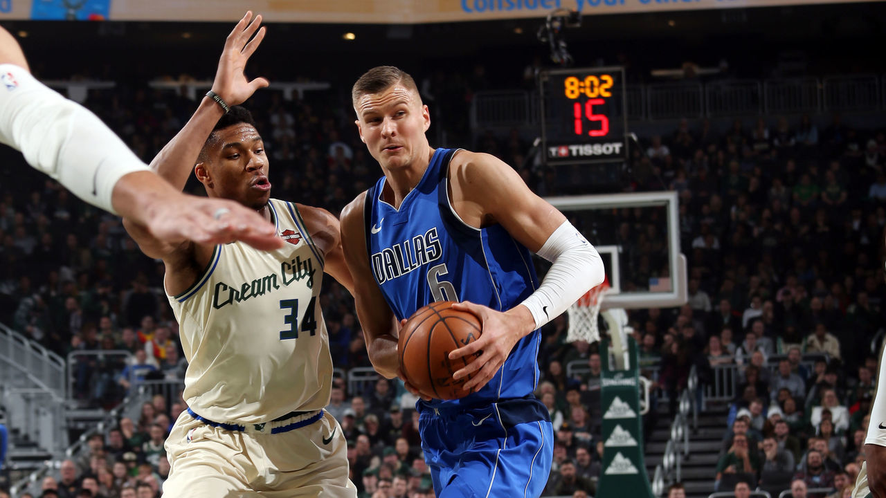 MILWAUKEE, WI - DECEMBER 16: Kristaps Porzingis #6 of the Dallas Mavericks drives to the basket during the game against the Milwaukee Bucks on December 16, 2019 at the Fiserv Forum Center in Milwaukee, Wisconsin. Mandatory Copyright Notice: Copyright 2019 NBAE .