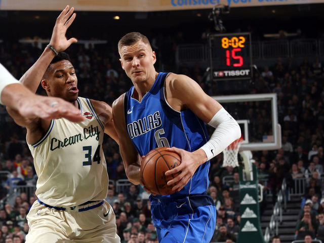 MILWAUKEE, WI - DECEMBER 16: Kristaps Porzingis #6 of the Dallas Mavericks drives to the basket during the game against the Milwaukee Bucks on December 16, 2019 at the Fiserv Forum Center in Milwaukee, Wisconsin. Mandatory Copyright Notice: Copyright 2019 NBAE .