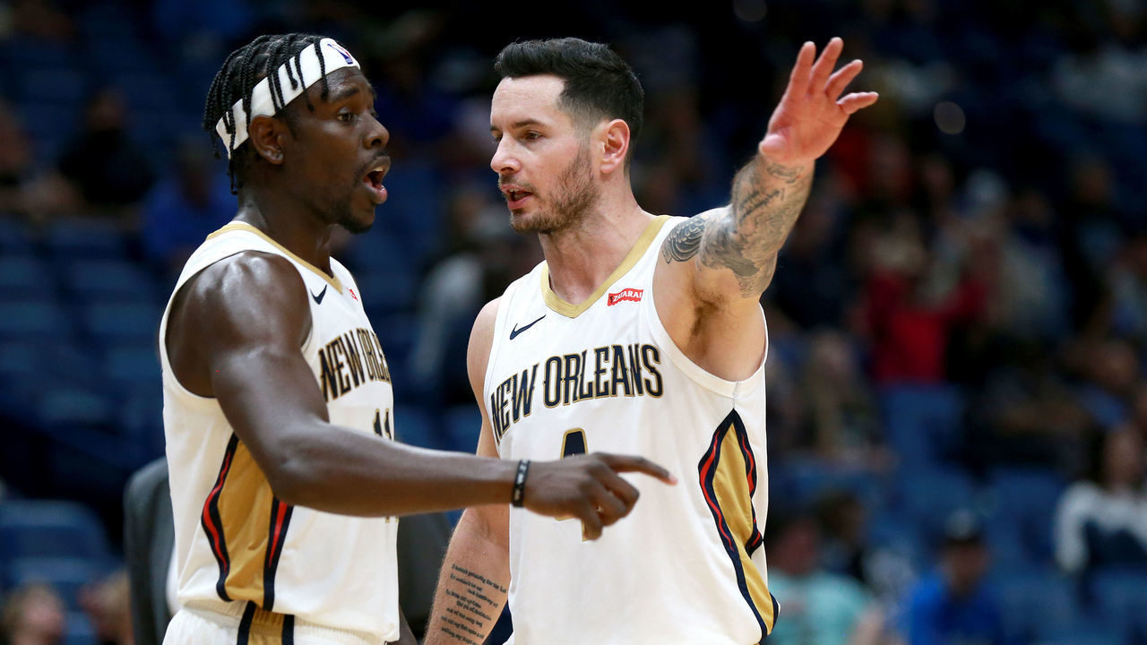 NEW ORLEANS, LOUISIANA - DECEMBER 15: Jrue Holiday #11 of the New Orleans Pelicans and JJ Redick #4 of the New Orleans Pelicans stand on the court during a NBA game against the Orlando Magic at Smoothie King Center on December 15, 2019 in New Orleans, Louisiana.