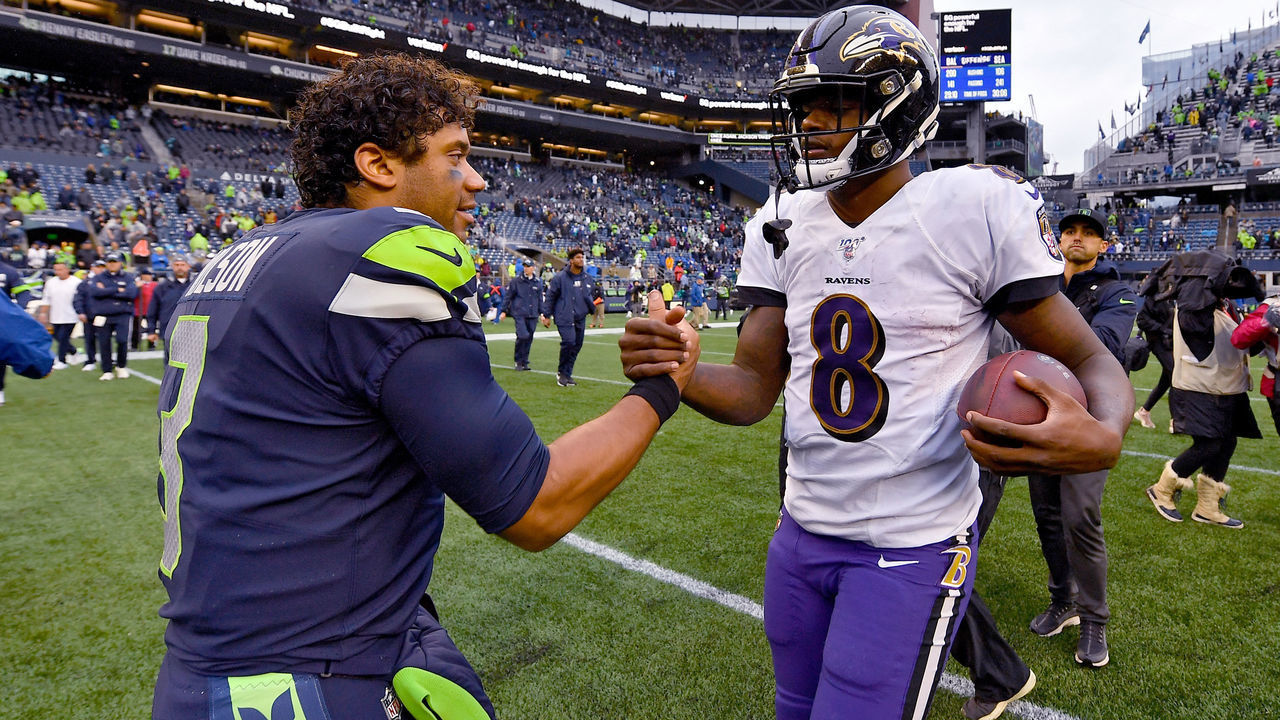 SEATTLE, WASHINGTON - OCTOBER 20: Russell Wilson #3 of the Seattle Seahawks and Lamar Jackson #8 of the Baltimore Ravens shake hands after the game at CenturyLink Field on October 20, 2019 in Seattle, Washington. The Baltimore Ravens top the Seattle Seahawks 30-16.