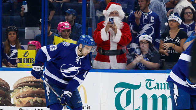 TAMPA, FL - DECEMBER 22: Cedric Paquette #13 of the Tampa Bay Lightning skates in front of a fan dressed up as Santa Claus and against the St. Louis Blues during the pregame warm ups at Amalie Arena on December 22, 2016 in Tampa, Florida.