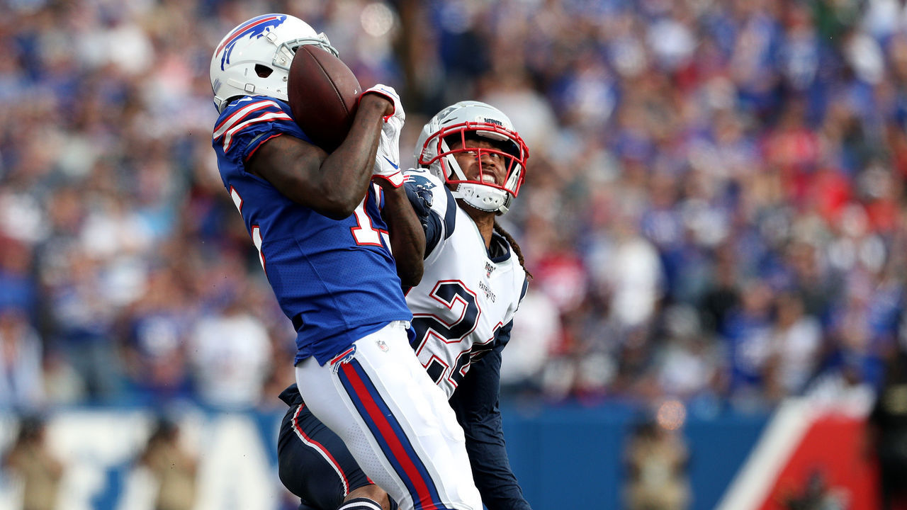 ORCHARD PARK, NEW YORK - SEPTEMBER 29: John Brown #15 of the Buffalo Bills catches the ball as Stephon Gilmore #24 of the New England Patriots attempts to defend him during the fourth quarter at New Era Field on September 29, 2019 in Orchard Park, New York.