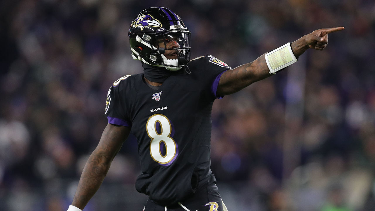 BALTIMORE, MARYLAND - DECEMBER 12: Quarterback Lamar Jackson #8 of the Baltimore Ravens celebrates after a touchdown in the first quarter of the game against the New York Jets at M&T Bank Stadium on December 12, 2019 in Baltimore, Maryland.