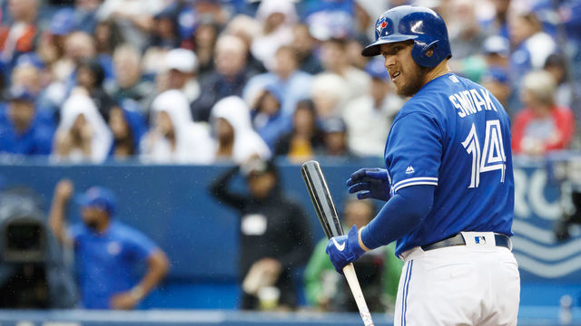 TORONTO, ON - SEPTEMBER 28: Justin Smoak #14 of the Toronto Blue Jays takes an at bat during the first inning of their MLB game against the Tampa Bay Rays at Rogers Centre on September 28, 2019 in Toronto, Canada.