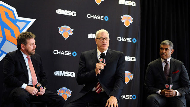 NEW YORK, NY - MARCH 18: (L to R) James Dolan, Executive Chairman of Madison Square Garden, Phil Jackson, and Steve Mills, General Manager of the New York Knicks, answer questions during the press conference to announce Jackson as President of the New York Knicks at Madison Square Garden on March 18, 2014 in New York City.