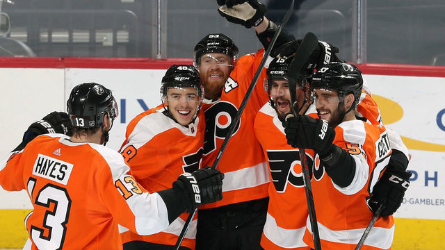 PHILADELPHIA, PA - DECEMBER 19: Kevin Hayes #13 of the Philadelphia Flyers skates over to be congratulated by teammates Tyler Pitlick #18, Jakub Voracek #93, Matt Niskanen #15, and Shayne Gostisbehere #53 after they scored agains the Buffalo Sabres on December 19, 2019 at the Wells Fargo Center in Philadelphia, Pennsylvania.