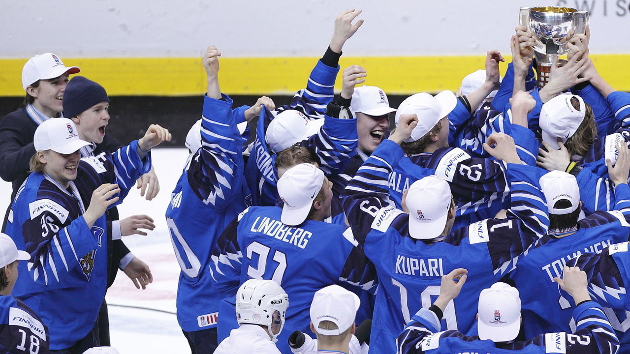 VANCOUVER , BC - JANUARY 5: Finland celebrates with the trophy after a victory against the United States following the gold medal game at the IIHF World Junior Championships at Rogers Arena on January 5, 2019 in Vancouver, British Columbia, Canada.