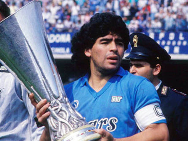 UNSPECIFIED, ITALY - UNDATED: Diego Armando Maradona holds up a trophy in this undated photo in Italy.