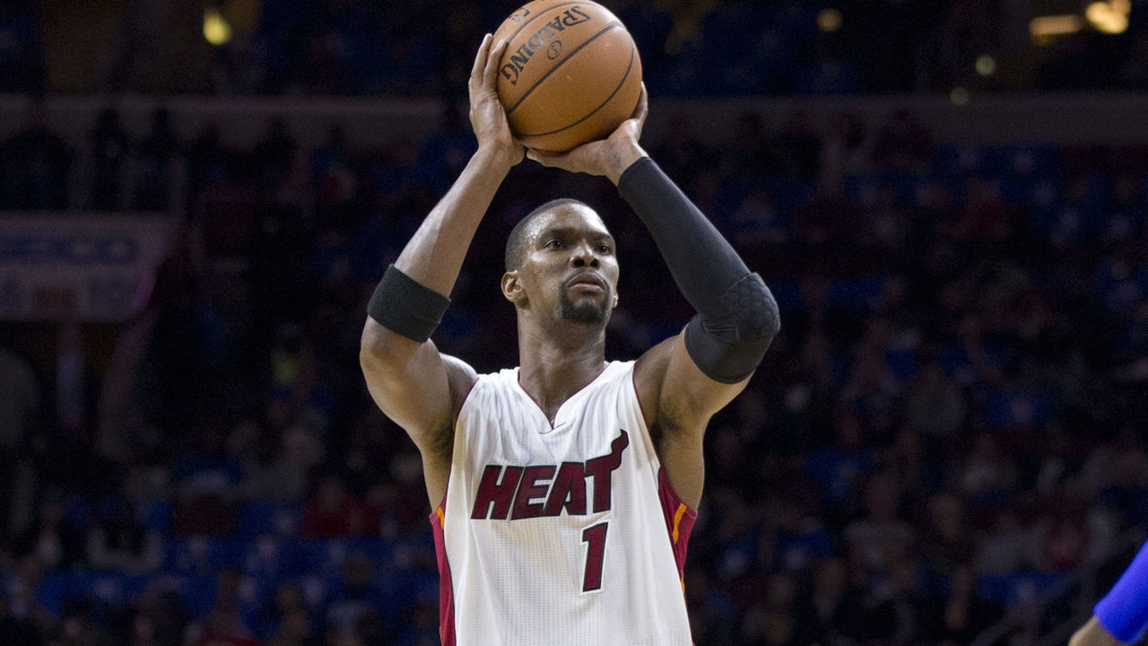 PHILADELPHIA, PA - NOVEMBER 1: Chris Bosh #1 of the Miami Heat makes a three point shot against the Philadelphia 76ers on November 1, 2014 at the Wells Fargo Center in Philadelphia, Pennsylvania.