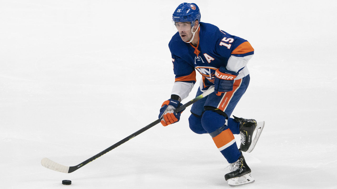 UNIONDALE, NY - DECEMBER 17: New York Islanders Right Wing Cal Clutterbuck (15) skates with the puck during the first period of the National Hockey League game between the Nashville Predators and the New York Islanders on December 17, 2019, at the Nassau Veterans Memorial Coliseum in Uniondale, NY.