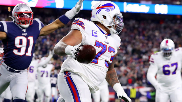 FOXBOROUGH, MASSACHUSETTS - DECEMBER 21: Dion Dawkins #73 of the Buffalo Bills scores a touchdown against the New England Patriots at Gillette Stadium on December 21, 2019 in Foxborough, Massachusetts.