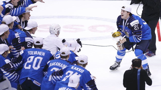 VANCOUVER , BC - JANUARY 5: Aarne Talvitie #25 of Finland prepares to lift the trophy following a victory against the United States after the gold medal game at the IIHF World Junior Championships at Rogers Arena on January 5, 2019 in Vancouver, British Columbia, Canada.