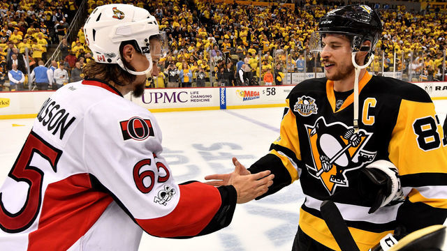PITTSBURGH, PA - MAY 25: (L-R) Erik Karlsson #65 of the Ottawa Senators congratulates Sidney Crosby #87 of the Pittsburgh Penguins after winning Game Seven of the Eastern Conference Final during the 2017 NHL Stanley Cup Playoffs at PPG PAINTS Arena on May 25, 2017 in Pittsburgh, Pennsylvania.