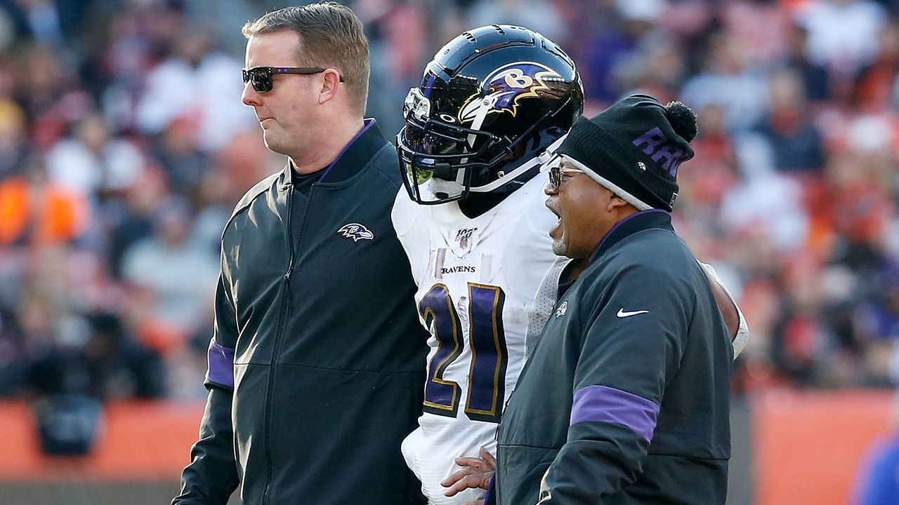 CLEVELAND, OH - DECEMBER 22: Mark Ingram II #21 of the Baltimore Ravens is helped off of the field after getting injured during the fourth quarter at FirstEnergy Stadium on December 22, 2019 in Cleveland, Ohio. Baltimore defeated Cleveland 31-15.