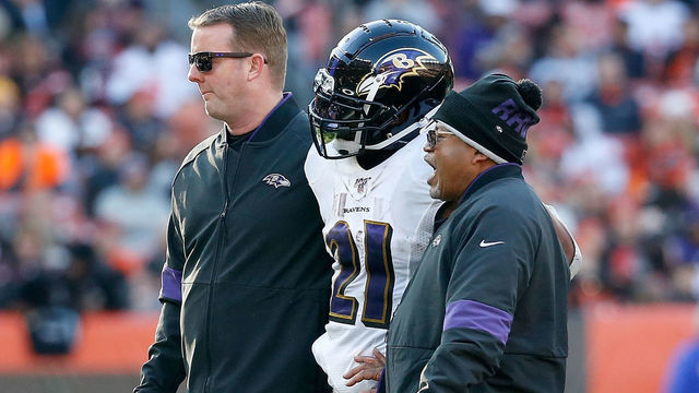CLEVELAND, OH - DECEMBER 22: Mark Ingram II #21 of the Baltimore Ravens is helped off of the field after getting injured during the fourth quarter at FirstEnergy Stadium on December 22, 2019 in Cleveland, Ohio. Baltimore defeated Cleveland 31-15.