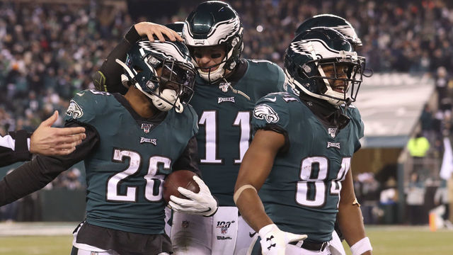 PHILADELPHIA, PA - DECEMBER 22: Miles Sanders #26, Carson Wentz #11, and Greg Ward #84 of the Philadelphia Eagles react in the final moments of the game against the Dallas Cowboys at Lincoln Financial Field on December 22, 2019 in Philadelphia, Pennsylvania. The Eagles defeated the Cowboys 17-9.