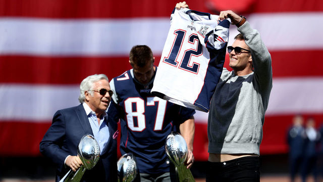 BOSTON, MA - APRIL 3: Tom Brady #12 of the New England Patriots shows off his Super Bowl LI jersey before the opening day game between the Boston Red Sox and the Pittsburgh Pirates at Fenway Park on April 3, 2017 in Boston, Massachusetts.