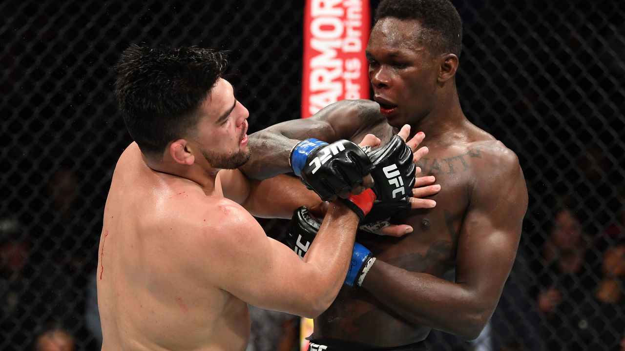 ATLANTA, GA - APRIL 13: (R-L) Israel Adesanya punches Kelvin Gastelum in their interim middleweight championship bout during the UFC 236 event at State Farm Arena on April 13, 2019 in Atlanta, Georgia.