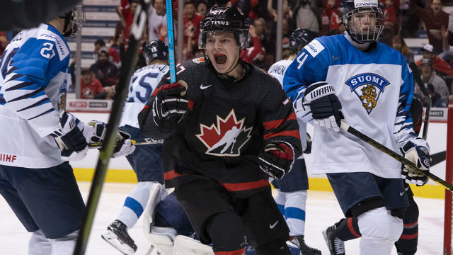 VANCOUVER, BC - JANUARY 2: Barrett Hayton #27 of Canada celebrates teammate Ian Mitchell's #5 (not pictured) goal as Ville Heinola #34 of Finland skates past in Quarterfinal hockey action of the 2019 IIHF World Junior Championship on January, 2, 2019 at Rogers Arena in Vancouver, British Columbia, Canada.