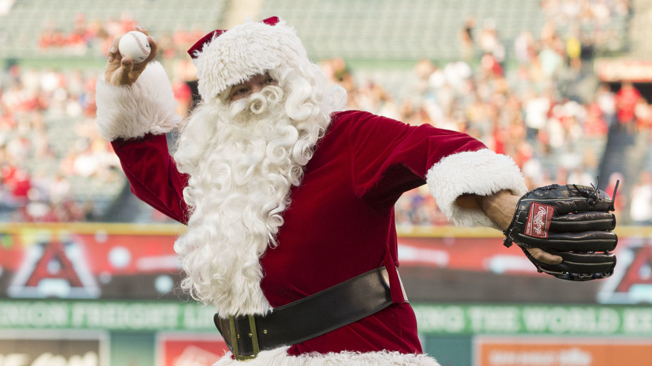 ANAHEIM, CA - JUNE 25: Santa Claus throws out a ceremonial first pitch as part of a "Christmas in June" promotion before the game between the Oakland Athletics and the Los Angeles Angels of Anaheim at Angel Stadium of Anaheim on June 25, 2016 in Anaheim, California.