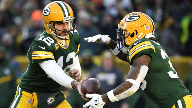 GREEN BAY, WISCONSIN - DECEMBER 15: Aaron Rodgers #12 of the Green Bay Packers hands the football off during the game against the Chicago Bears at Lambeau Field on December 15, 2019 in Green Bay, Wisconsin.