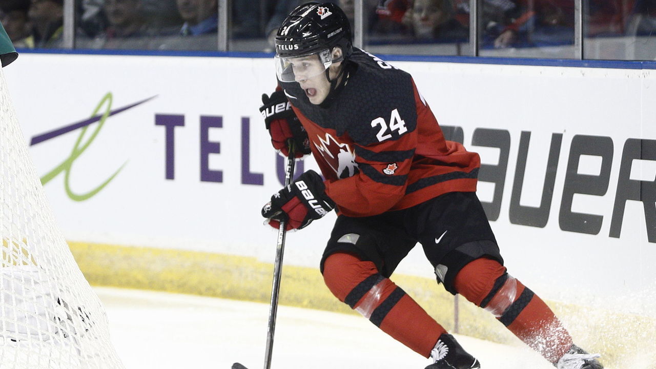 VICTORIA , BC - DECEMBER 19: Ty Smith #24 of Team Canada skates with the puck versus Team Switzerland at the IIHF World Junior Championships at the Save-on-Foods Memorial Centre on December 19, 2018 in Victoria, British Columbia, Canada. Canada defeated Switzerland 5-3. "n"n"n"n