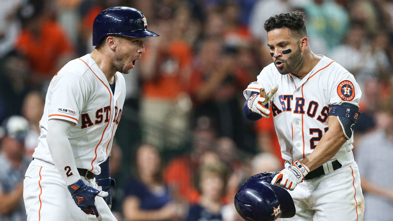 HOUSTON, TEXAS - AUGUST 03: Jose Altuve #27 of the Houston Astros receives congratulations from Alex Bregman #2 after hitting a home run in the fifth inning against the Seattle Mariners at Minute Maid Park on August 03, 2019 in Houston, Texas.