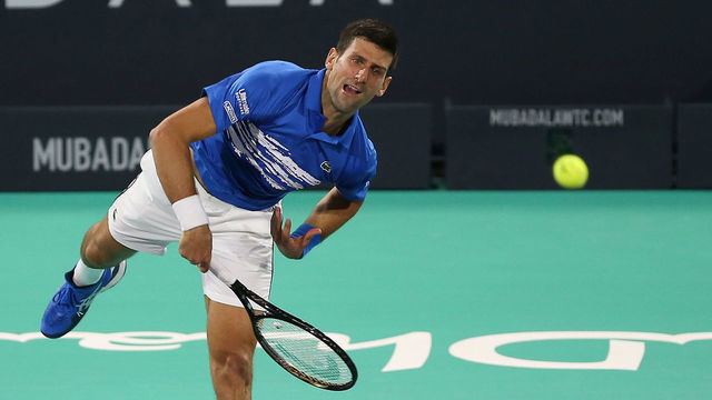 Serbia's Novak Djokovic in action against Greece's Stefanos Tsitsipas (unseen) during the Mubadala World Tennis Championship at Zayed Sports City in Abu Dhabi on December 20, 2019.